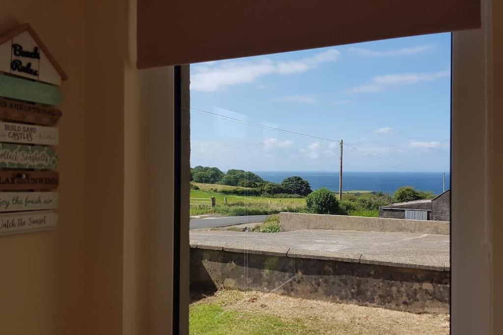 Mcconaghys Glenside Farmhouse Whitepark Bay บาลลินทอย ภายนอก รูปภาพ